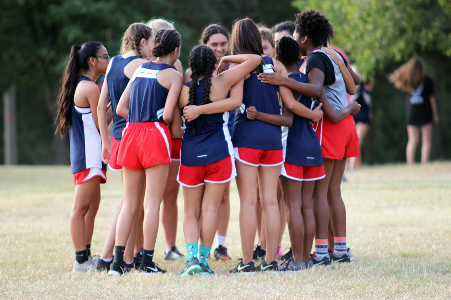 The JV girls huddled around one another at the Guyer Wildcat Prowl.